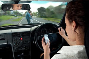 woman texting while driving